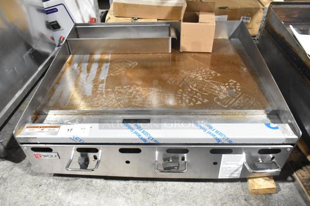 Wolf AGM36-101 stainless steel commercial griddle, natural gas, 81,000 BTU, used condition, visible brand label.
