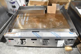 Wolf AGM36-101 stainless steel commercial griddle, natural gas, 81,000 BTU, used condition, visible brand label.