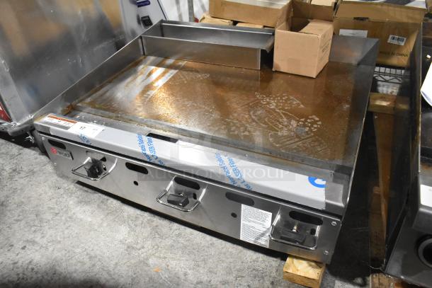 Wolf AGM36-101 stainless steel natural gas flat top griddle, 81,000 BTU, commercial countertop, used condition, visible labels.