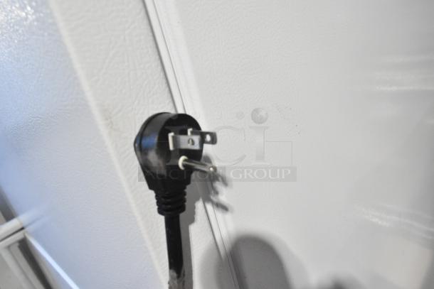 Power plug of a Hoshizaki AM-50BAK Ice Machine with a white textured wall background. 115 Volts, 1 Phase.