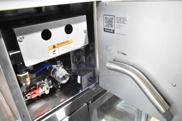 BRAND NEW SCRATCH AND DENT Cooking Performance Group FCPG15 Natural Gas Fryer, 26,500 BTU, metal basket, interior view.