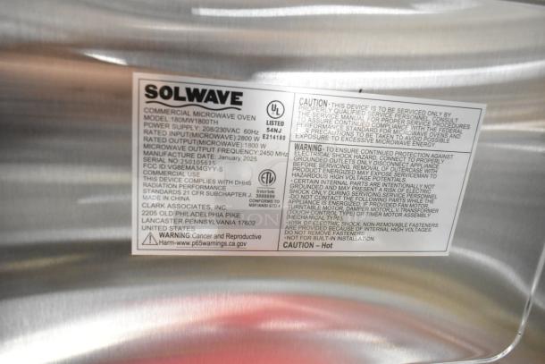 Alt text: Solwave 180MW1800TH commercial microwave label showing specs, caution, and safety warnings. 208/240V, 1.2 cu. ft. interior.