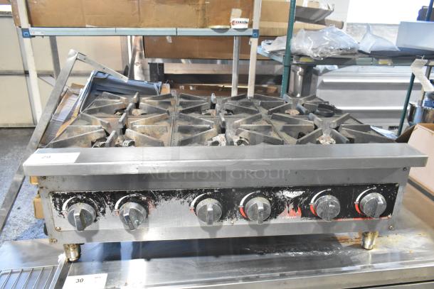 Vollrath HPA1006 stainless steel countertop charbroiler, natural gas powered, five-burner, used condition, commercial grade.