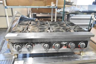 Vollrath HPA1006 stainless steel countertop charbroiler, natural gas powered, five-burner, used condition, commercial grade.
