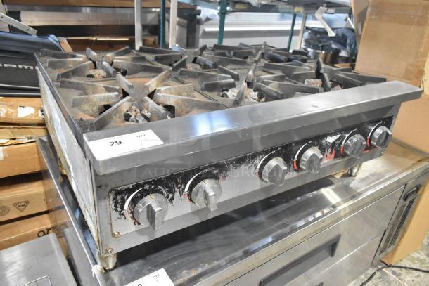 Vollrath HPA1006 stainless steel commercial charbroiler with 6 burners. Natural gas powered, well-used condition.