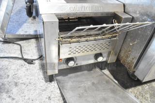 AvaToast CTA7001 stainless steel commercial countertop conveyor toaster oven, 120 volts, 1 phase. Visible wear, caution hot label.