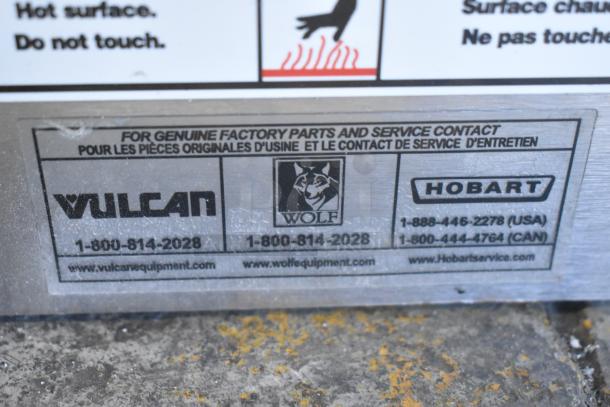 Vulcan stainless steel commercial cheese melter with service contact info for Vulcan, Wolf, and Hobart. Good condition.