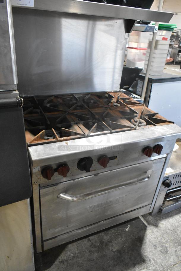 Vulcan Stainless Steel Commercial Gas Range, 6 burners with oven, over shelf, and back splash, good condition.