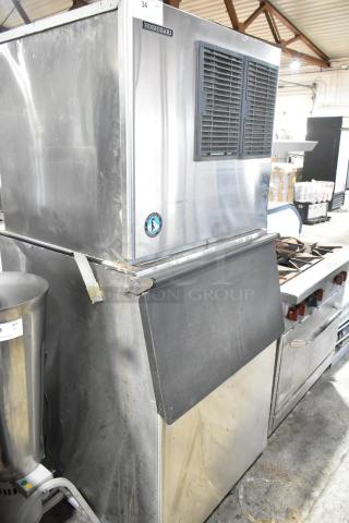Hoshizaki KML-631MAH stainless steel commercial ice head on Hoshizaki B-500SF bin, 208-230 volts, 1 phase, showing signs of use.