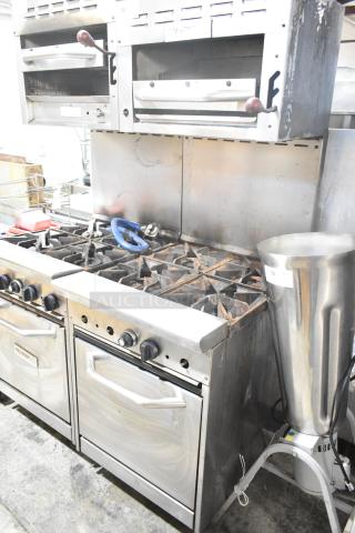Tri-Star TSR-1 stainless steel commercial range with 4 burners, oven, salamander cheese melter, and backsplash.