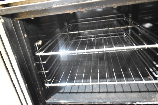 Tri-Star TSR-1 stainless steel range interior, showing clean oven racks, commercial-grade durability.