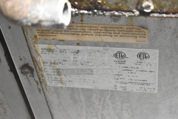 Alt text: Tri-Star TSR-1 range label showing ETL certification and safety warnings. Stainless steel, natural gas, 4 burners.