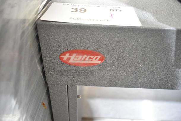Hatco GRHD-3PD metal warming display case, 2-tier, countertop, 120V, label showing Hatco branding and auction info.