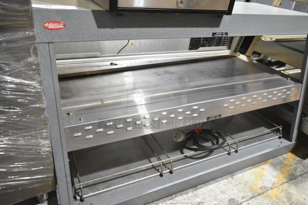 Hatco GRHD-3PD metal commercial 2-tier warming display case, 120V. Features Hatco branding, stainless steel construction.