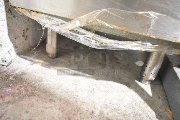 Vulcan LG300-1 stainless steel fryer base with protective plastic. Natural gas powered, 90,000 BTU, includes 2 baskets.