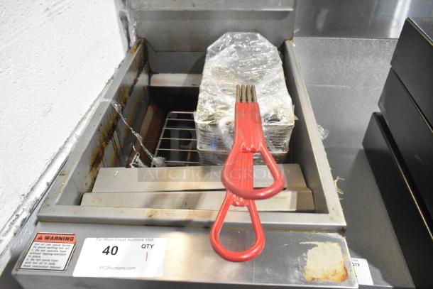 Vulcan LG300-1 stainless steel commercial fryer with 2 metal baskets, visible wear; natural gas powered, 90,000 BTU.
