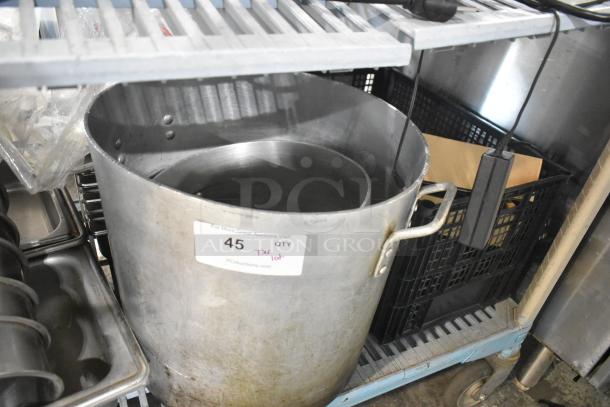 Metal stock pot and stainless steel cylindrical drop-in bins in metal rack. Lot tag reads "45 T4 Tier Lot."