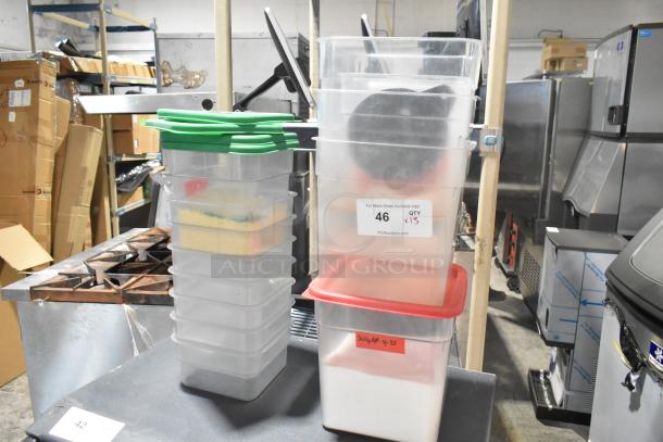 Lot of 13 poly storage bins with lids, varying colors, and visible labels, ideal for organization or storage.