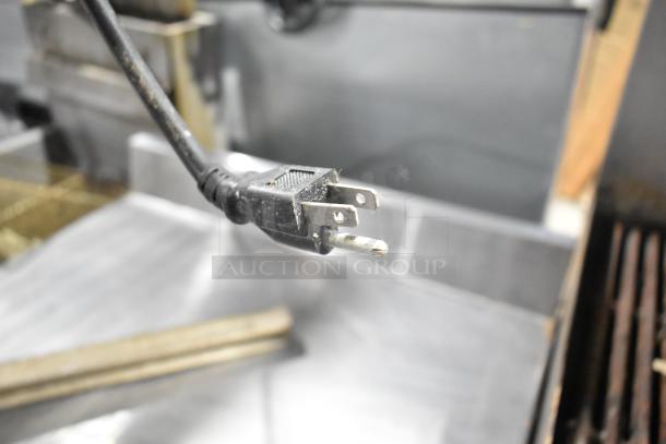 Avantco 178SSWT27FHC stainless steel commercial freezer power cord, 115V. Casters not visible in image.