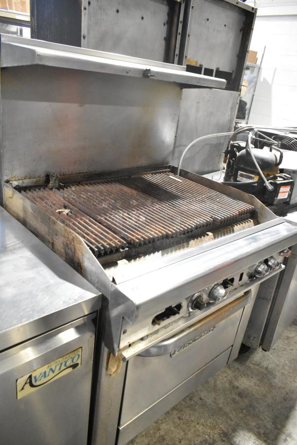 Southbend 436D-3C stainless steel commercial gas charbroiler grill with oven, overshelf, and backsplash on casters. Used condition.