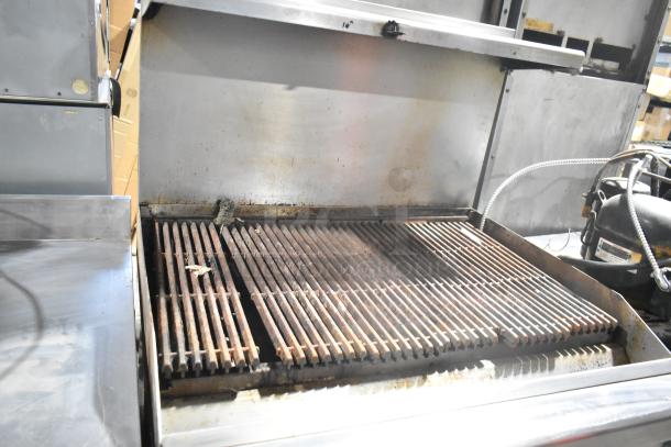 Southbend 436D-3C commercial stainless steel charbroiler grill with oven, over shelf, and back splash on casters, in used condition.