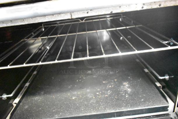 Southbend 436D-3C charbroiler grill interior view, showing stainless steel racks and oven space.