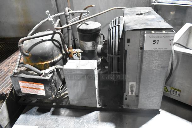 Copeland RRT10K1E-PFV-959 metal commercial compressor, 208/230V, 1 phase, robust condition, visible labels and fittings.
