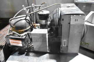 Copeland RRT10K1E-PFV-959 metal commercial compressor, 208/230V, 1 phase, robust condition, visible labels and fittings.