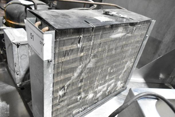 Copeland RRT10K1E-PFV-959 metal commercial compressor, 208/230V, 1 phase, with visible metal casing and product label.