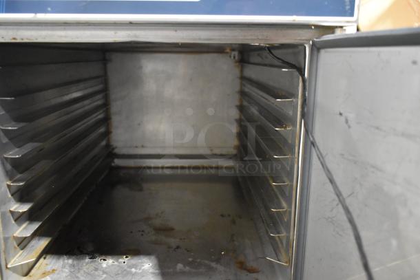 Alto Shaam 300-TH/III stainless steel commercial cook and hold oven interior, showing rack slots. Used condition.