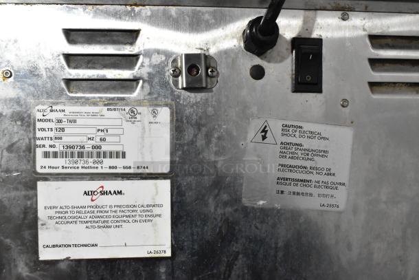 Alto Shaam 300-TH/III stainless steel commercial oven, 120V, 1 Phase, model plate and caution labels visible.