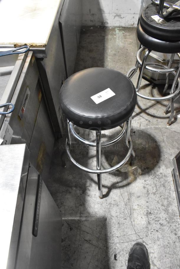 Chrome finish bar height stool with black cushion, minimal wear, auction item labeled "58".