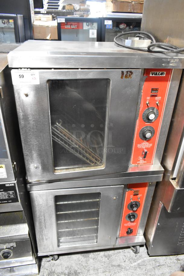 Vulcan stainless steel gas convection oven set, half-size, commercial use. Visible controls, large glass doors, used condition.