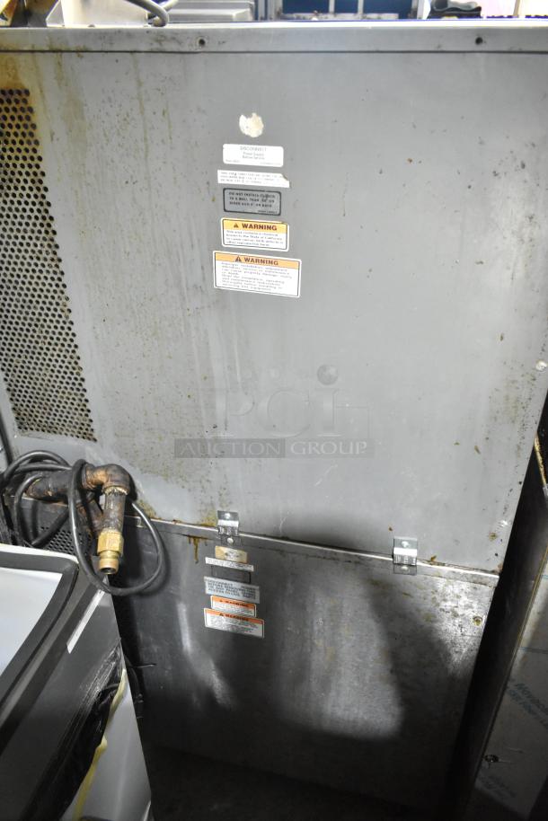 Vulcan stainless steel commercial gas convection oven, half-size, with warning labels, moderate wear, gas connectors visible.