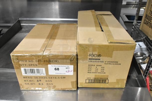 Two sealed boxes labeled Focus 900408 8" Springform Flat Pan and DPS-20 Digital Portion Scales, new condition.