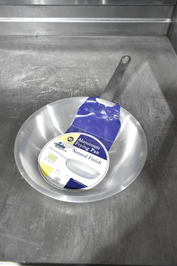 New Update International aluminum fry pan, scratch and dent, natural finish, model AFP-7, NSF certified, with label.