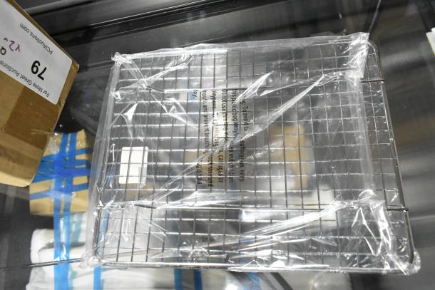2 new items: Update TD-MFOLD paper towel dispenser for multifold towels and Update PG810 half-size wire pan grate. Wrapped in plastic.