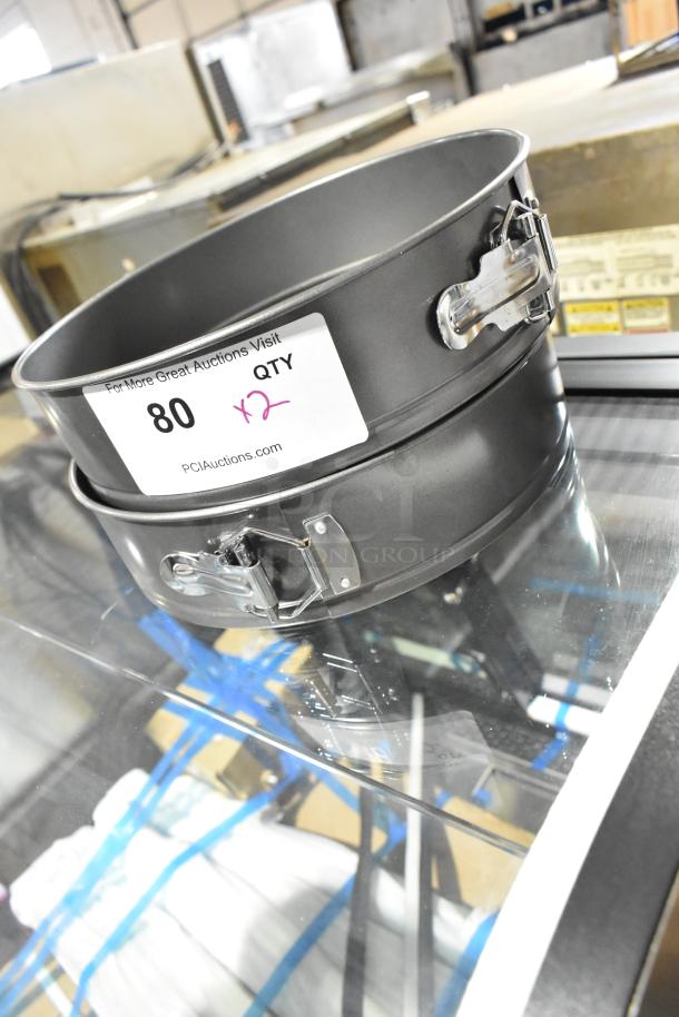 Two brand new Update CPSF-10 10" springform metal baking pans with locking mechanism, in excellent condition.