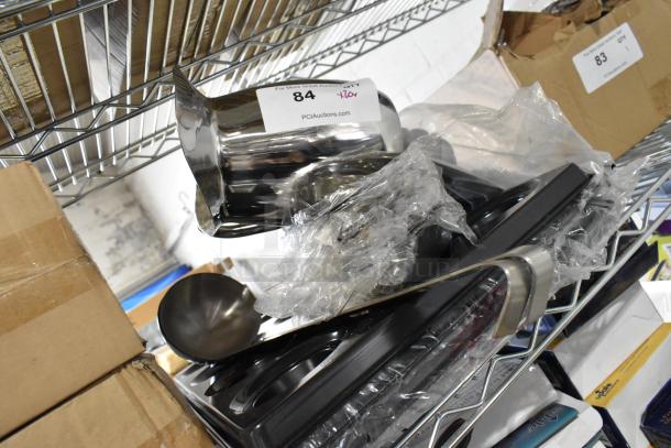 20 brand new kitchen items including a stainless steel pitcher and ladle, packaged together. Auction lot tag visible.