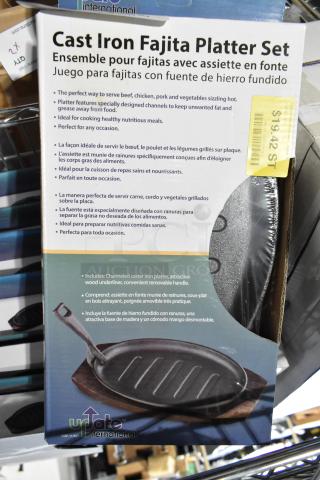 Brand new cast iron fajita platter set, includes 13 platters, channeled design, wood underliner, removable handle. Perfect for serving.