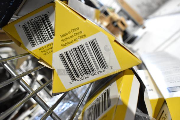 8 brand new Focus half-size silicone baking mats in packaging with visible barcodes, labeled "Made in China."