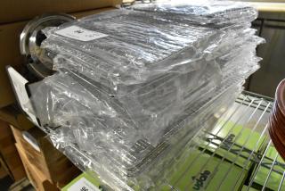 Brand new Update PG810 1/2 size wire pan grates, stacked and sealed in plastic. Perfect condition, 30 count.