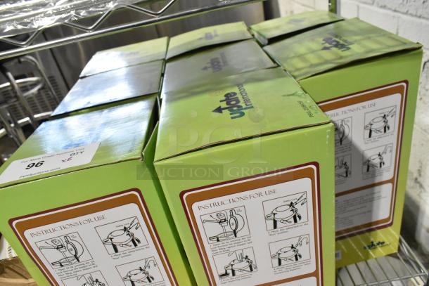 8 brand new Update International 2.5-liter stainless steel air pots in green boxes with instructions.
