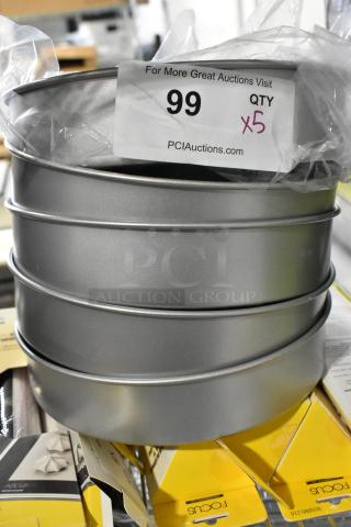 5 brand new Focus 9"x2" round cake baking pans, stacked. Tag shows quantity 5. Ideal for baking enthusiasts.