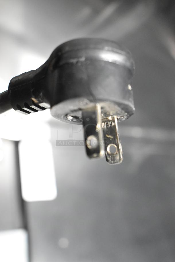 The image shows a close-up of a power plug for the True GDM-05-HC commercial countertop display refrigerator.