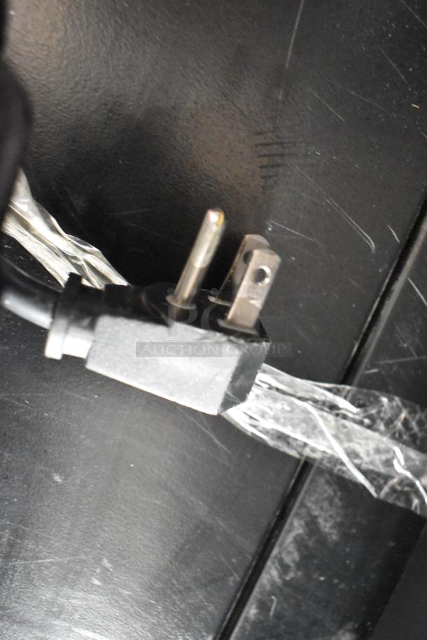Power plug of True GDM-12-LD cooler, showing three-prong plug with protective wrapping. Suitable for 115 Volts, 1 Phase.