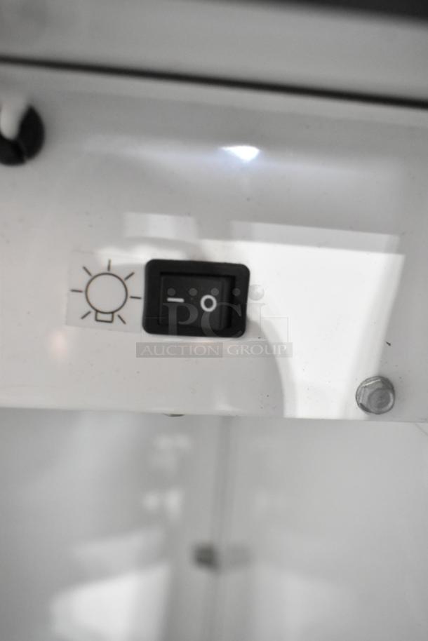 True GDM-12-LD cooler light switch with on/off labels and bolt details.
