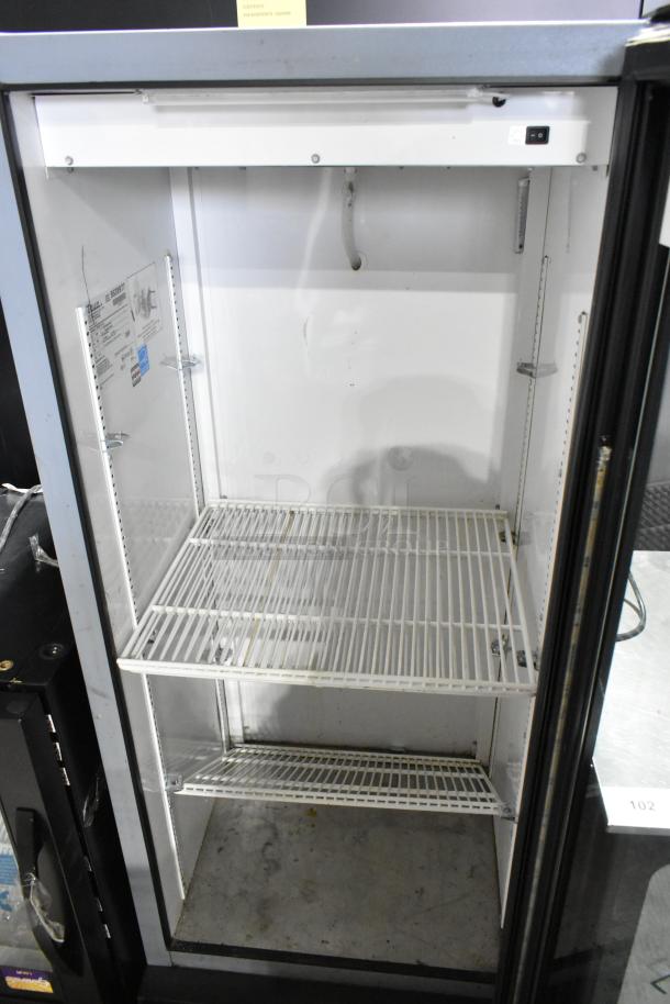 True GDM-12-LD metal commercial cooler with single glass door, poly coated racks, 115V, 1 phase, clean interior, minor wear.
