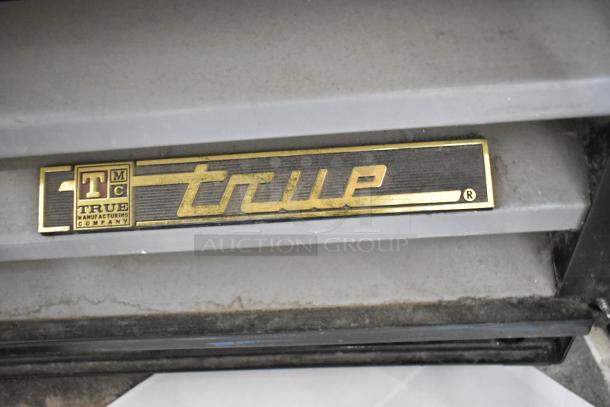 True GDM-12-LD cooler badge, metal commercial single door design, features poly coated racks, 115 volts, 1 phase.