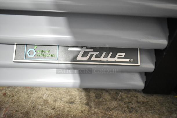 2025 True GDM-12-HC commercial cooler with metal finish, poly coated racks, 115V, 1 phase. True logo visible.